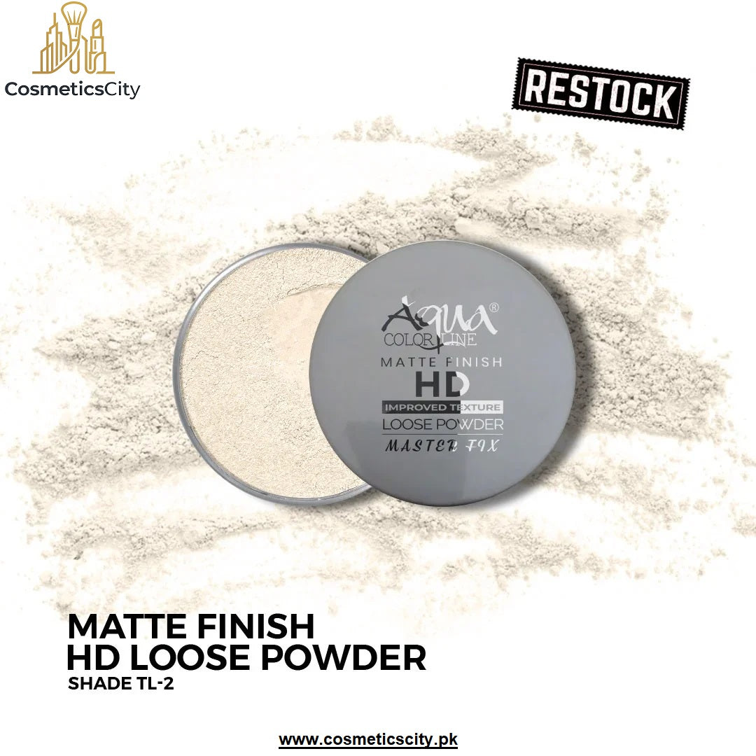 A cosmetic loose powder compact shown open with pale beige powder visible, placed on top of loose matching powder. The lid is gray with white text reading Aqua Cosmetics HD Matte Finish Loose Powder.