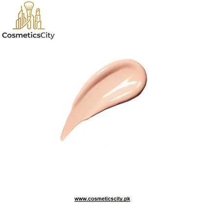 A glossy swatch of light peach-beige liquid foundation or cream makeup on a plain white background, with the CosmeticsCity logo in the top left and the website URL at the bottom.