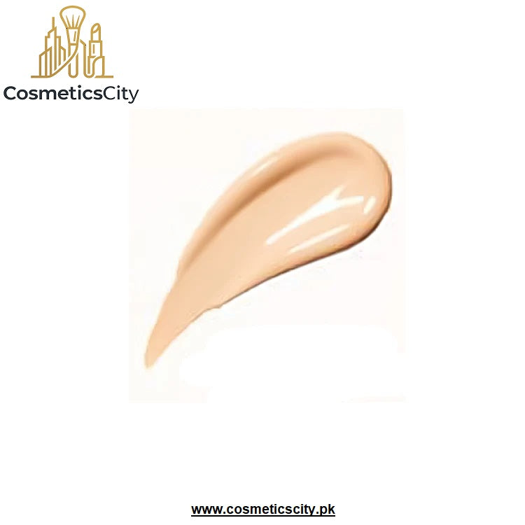 A swatch of liquid foundation in a warm beige shade, shown as a glossy smear on a white background with the CosmeticsCity logo in the top left corner.