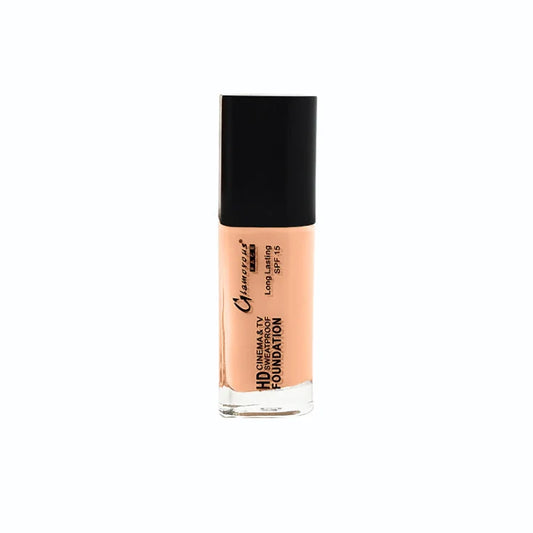 A bottle of Camille Clarysse HD Cinema & TV Foundation in shade SPF 15, showing the peach-colored liquid foundation through a clear glass bottle with a black cap, set against a plain white background.