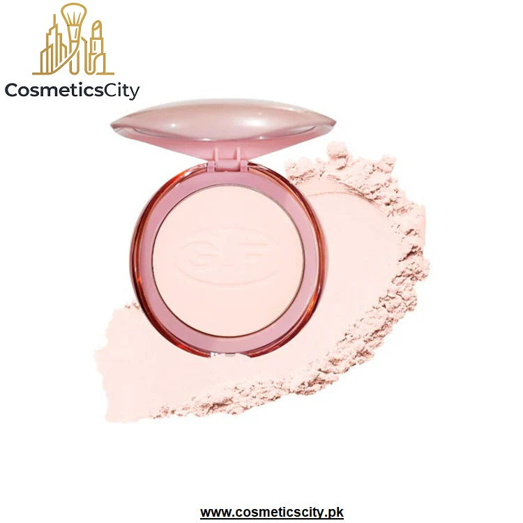 An open round makeup compact in a pale pink shade, shown with pressed powder smeared behind it on a white background. The compact has a glossy pink lid and a pink rim, and the powder pan has an embossed 'EC' logo.